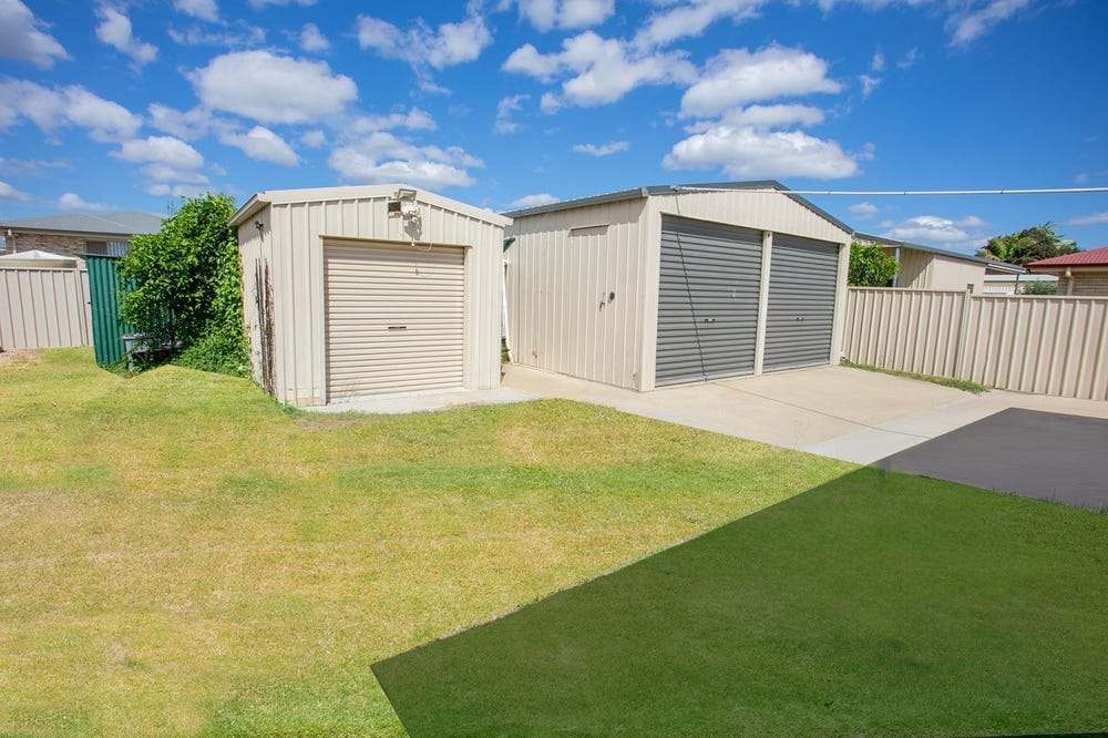 Brick home with sheds